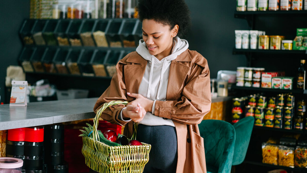 Pregnant Woman Holding Basket with Groceries