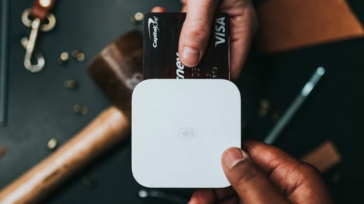 visa card paying with tap close up